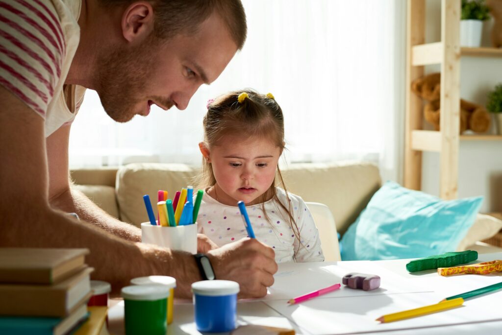 Girl with Down syndrome painting